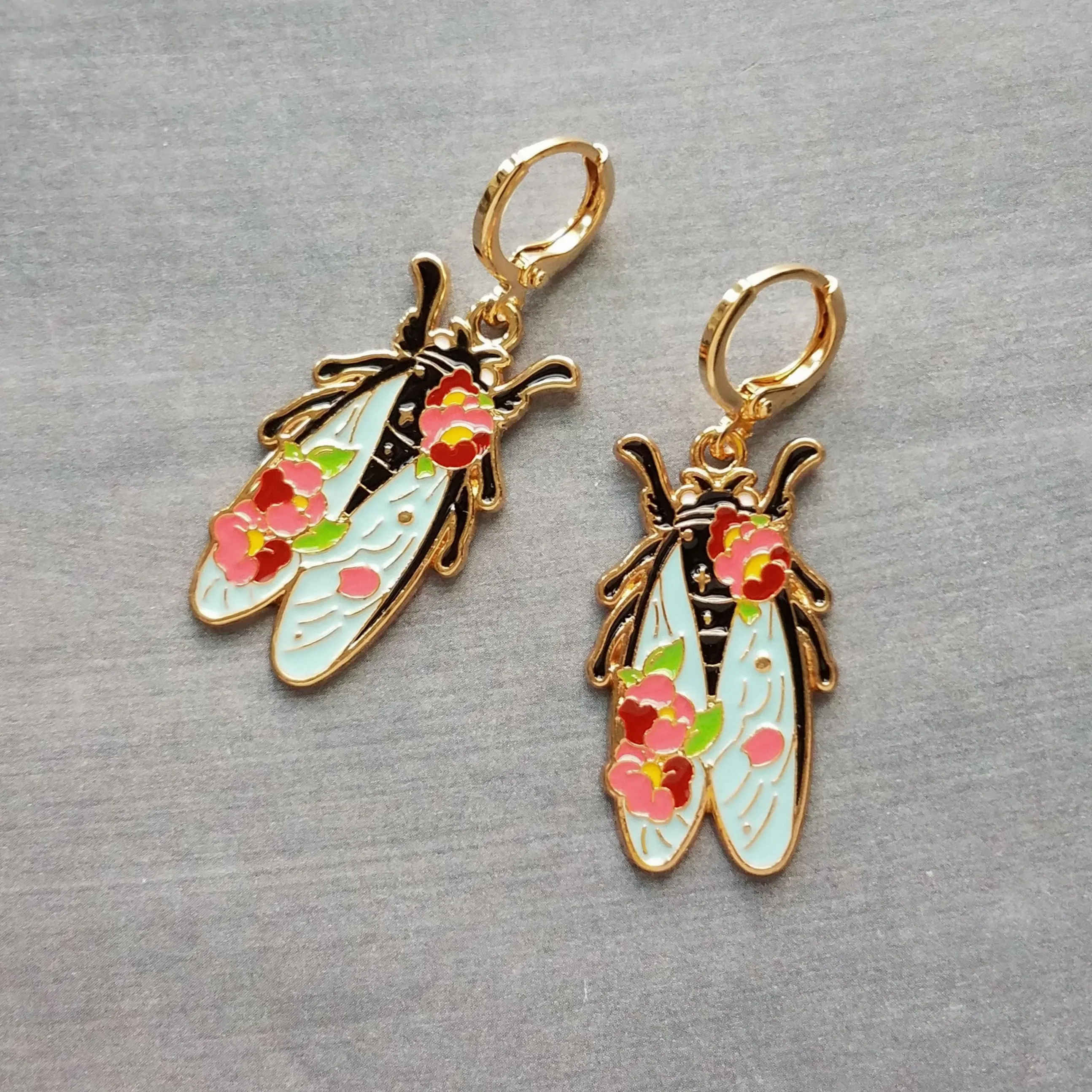 Insect Earrings, flying insect dangles, bug jewelry, gold huggie hoop, pink flowers on insect, insect jewelry, black enamel bug, fly earrings, snap close hoop, flying insect with blue wings