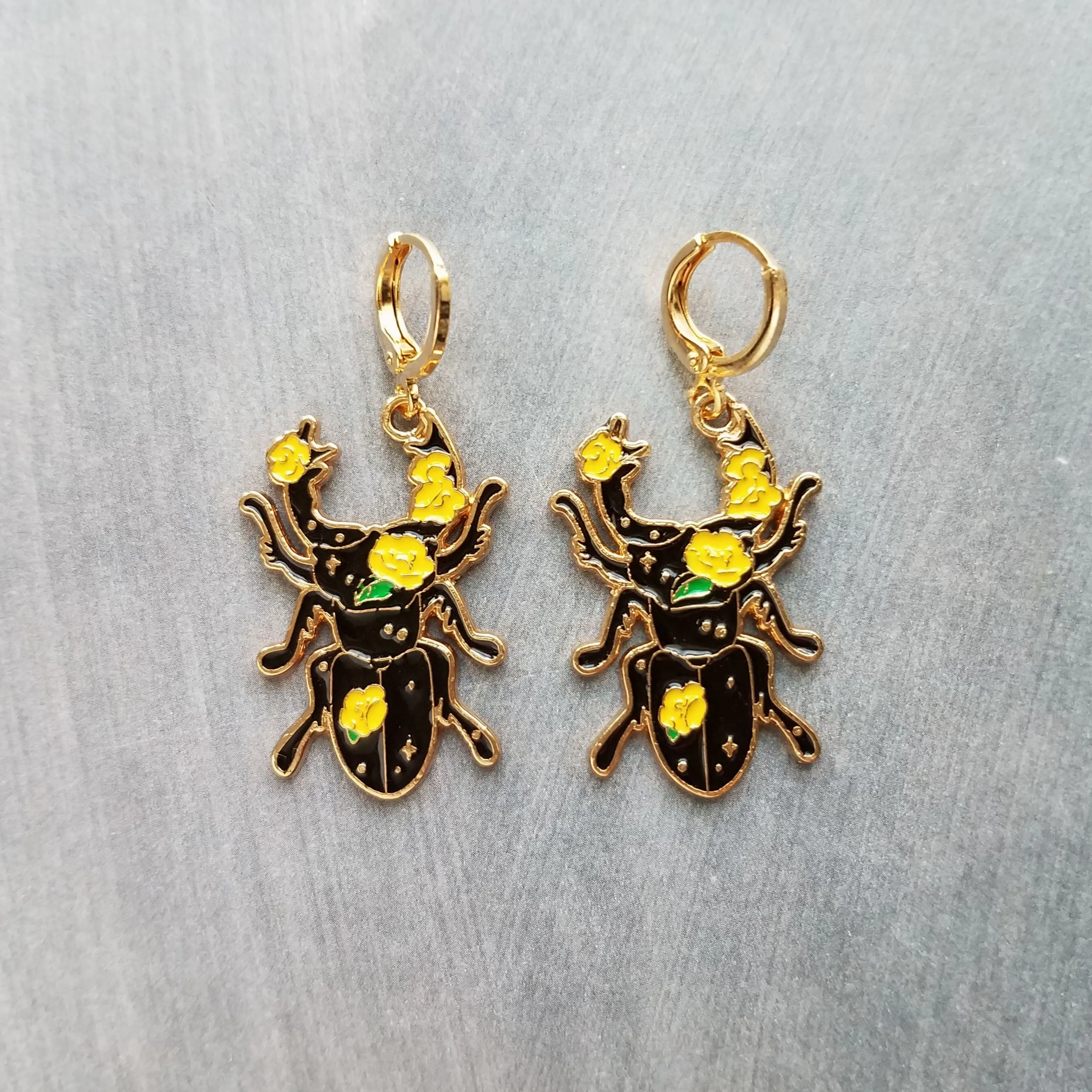 Insect Earrings, flying insect dangles, bug jewelry, gold huggie hoop, pink flowers on insect, insect jewelry, black enamel bug, fly earrings, snap close hoop, flying insect with blue wings