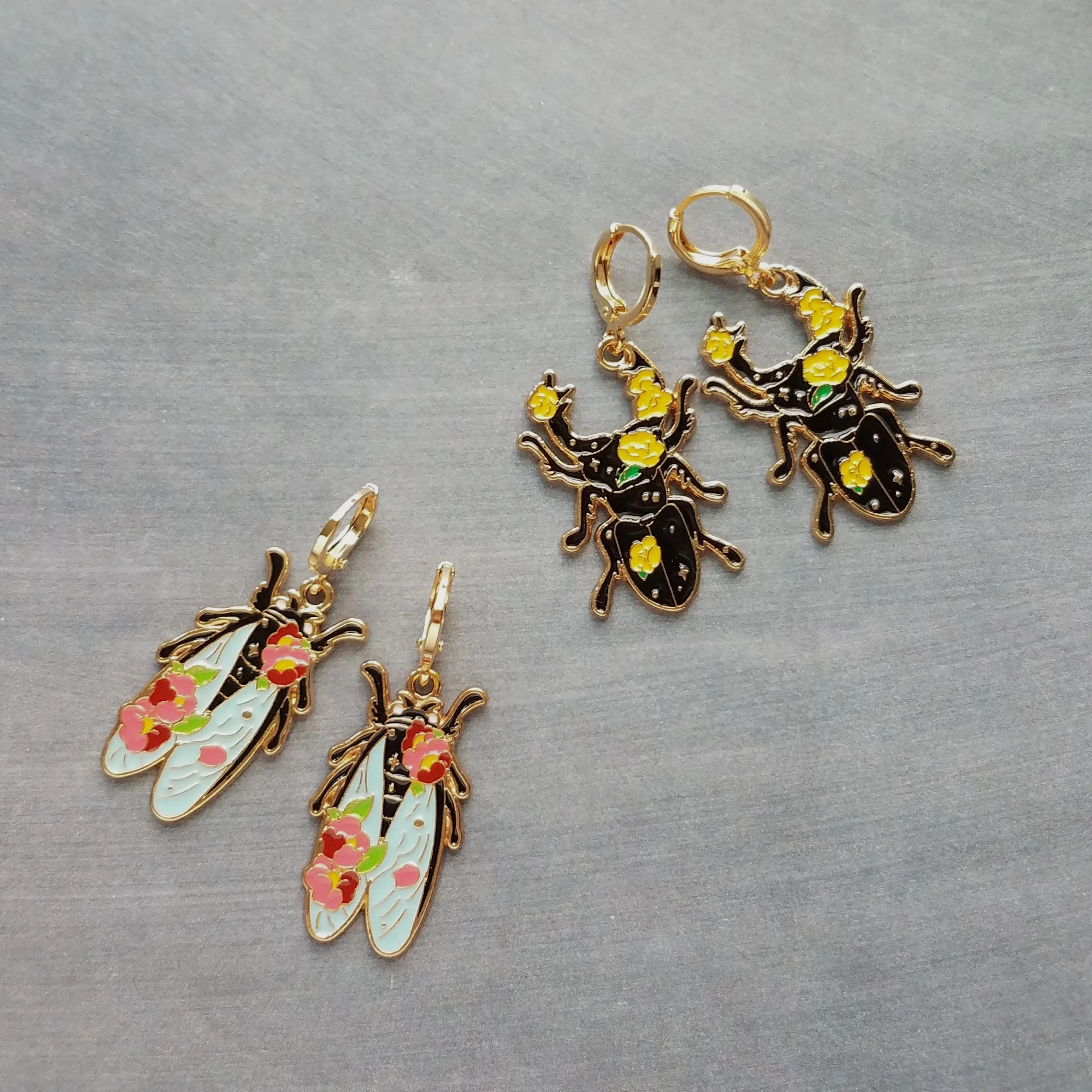 Insect Earrings, flying insect dangles, bug jewelry, gold huggie hoop, pink flowers on insect, insect jewelry, black enamel bug, fly earrings, snap close hoop, flying insect with blue wings